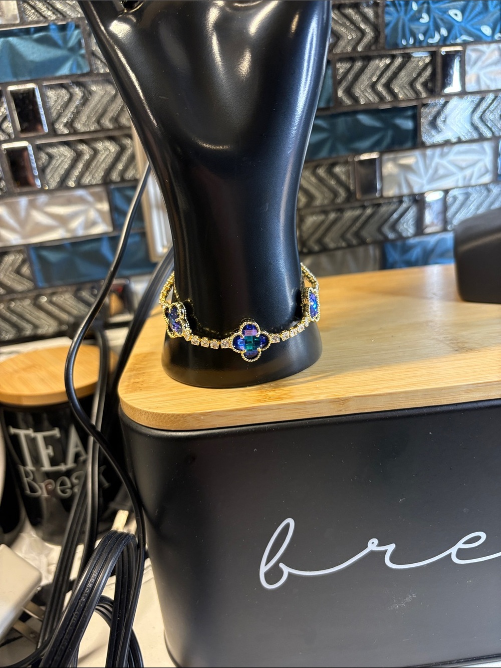 Gold-Tone Bracelet with Blue and Green Clover Accents